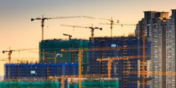 Buildings in construction with construction cranes